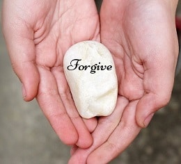 Forgive inscribed on a stone