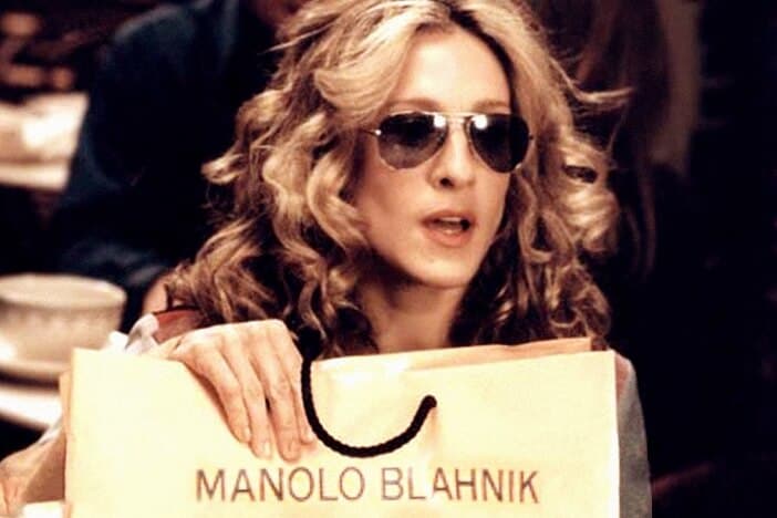 Carrie holding Manolo Blahniks